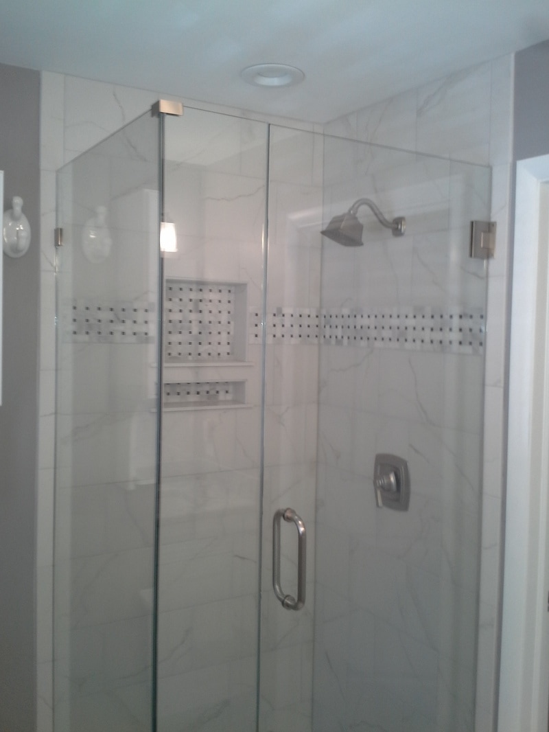 Bathroom Remodel, white marble tile, glass shower door, frameless shower doors, spa bathroom, black and white bathroom
