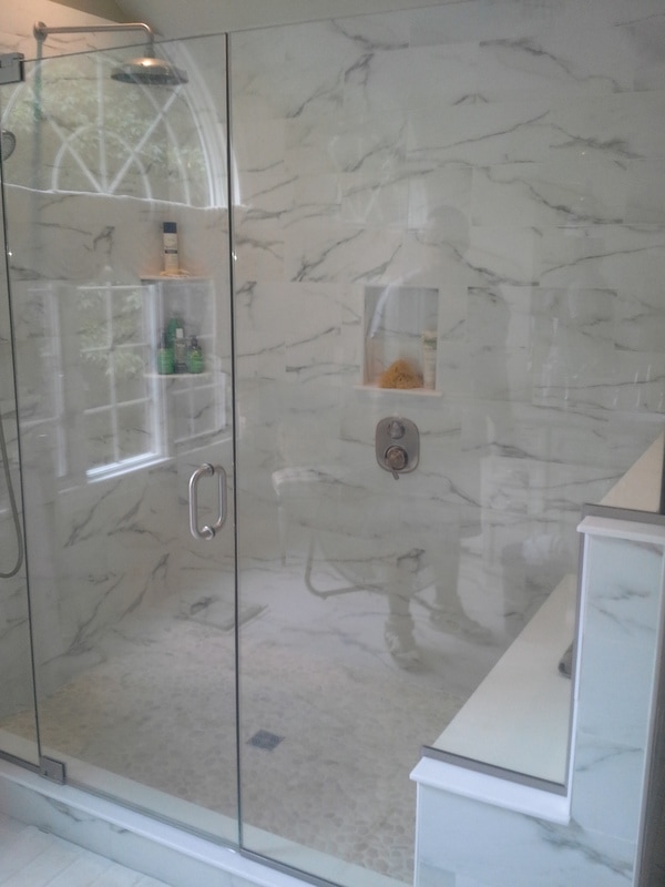 Bathroom Remodel, rain head fixture, white marble tile, custom glass doors, shower seat, shower niche, handheld shower, spa bathroom