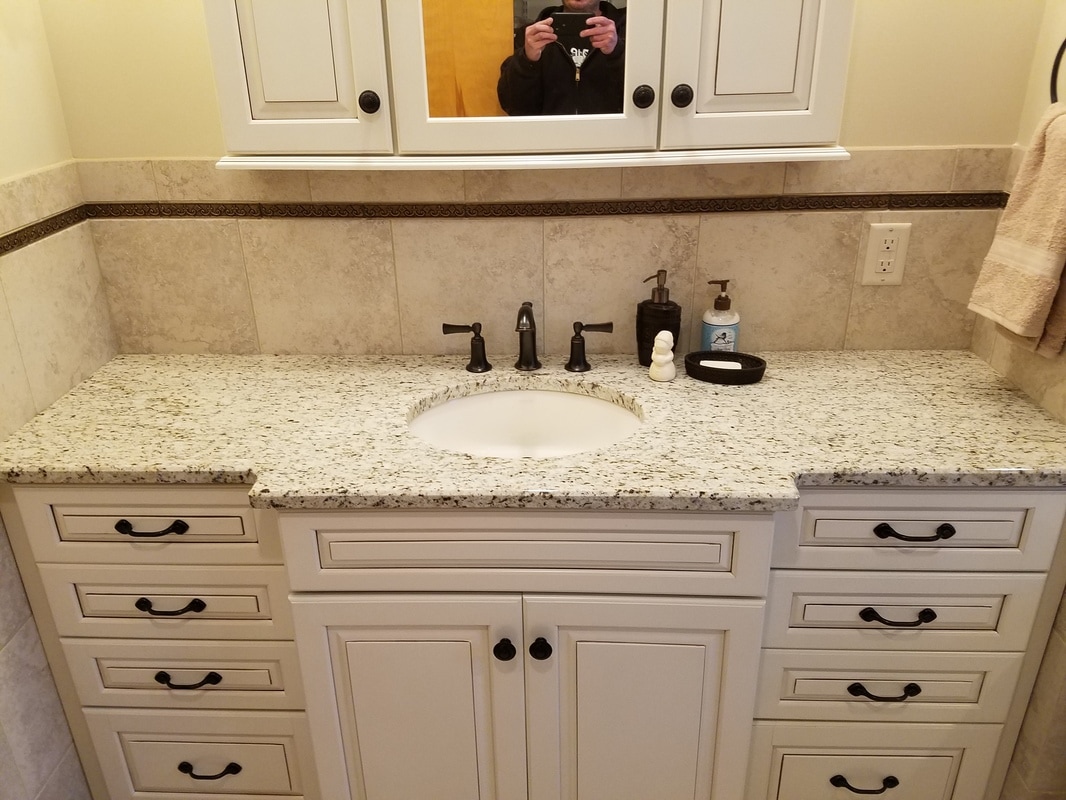 Cream cabinets, bathroom remodel, oil rubbed bronze, granite